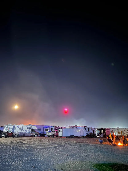 RV campsite at night with CAMP LOCATORS