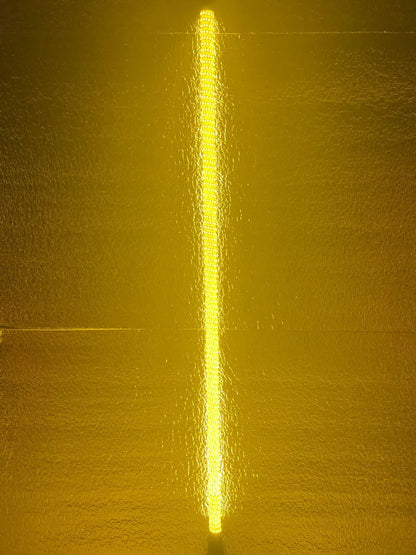 Yellow light beam on a textured yellow background